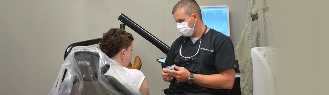 Dentist Chad Moore Meeting With Patient